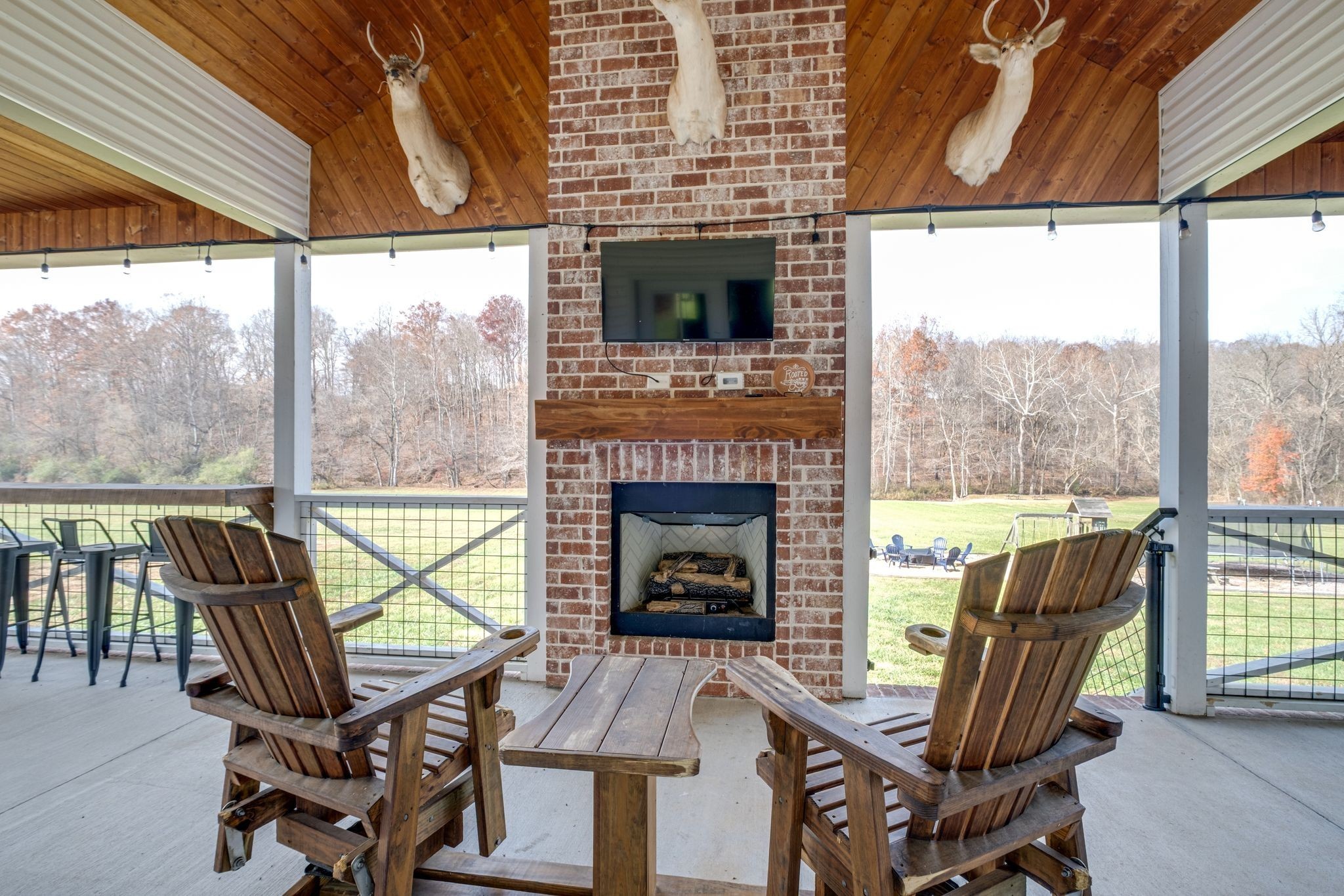 1227 Stayton Road Cumberland Furnace, TN 37051 - Photo 5 of 70 a living room with furniture a fireplace and a floor to ceiling window