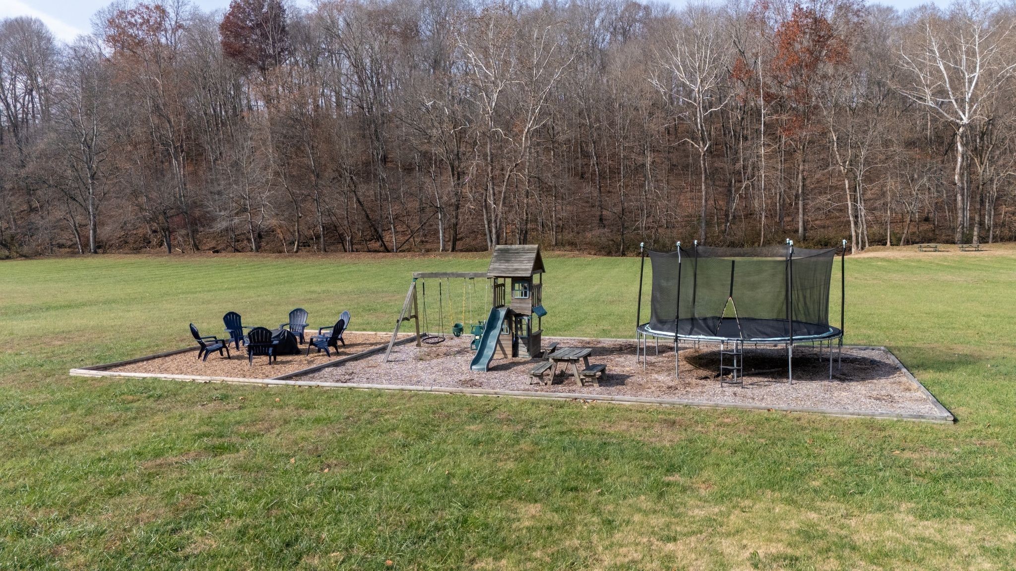 1227 Stayton Road Cumberland Furnace, TN 37051 - Photo 61 of 70 a view of a backyard with chairs and table