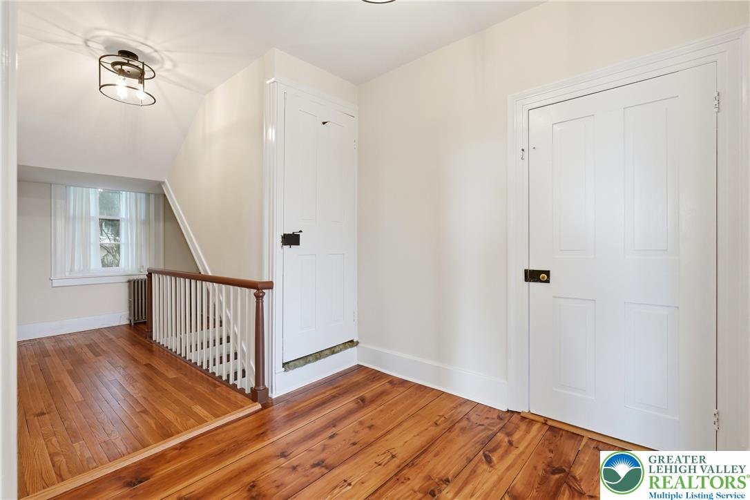 4682 Steuben Road Bethlehem, PA 18020 - Photo 25 of 79 Refinished wood flooring adds warmth to this versatile hallway with convenient storage access.