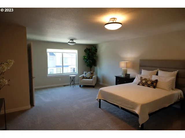 a bedroom with bed and window