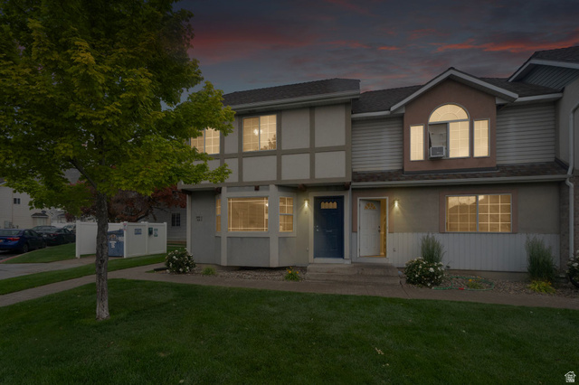 1099 South 950 East, Unit 17 Provo, UT 84606 - Photo 23 of 23 Townhouse exterior featuring a combination of stucco and horizontal siding, a pitched shingle roof, and multiple windows