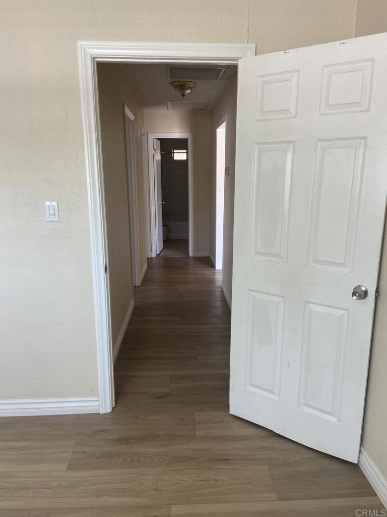 917 Broadview Street Spring Valley, CA 91977 - Photo 7 of 14 a view of a hallway with wooden floor