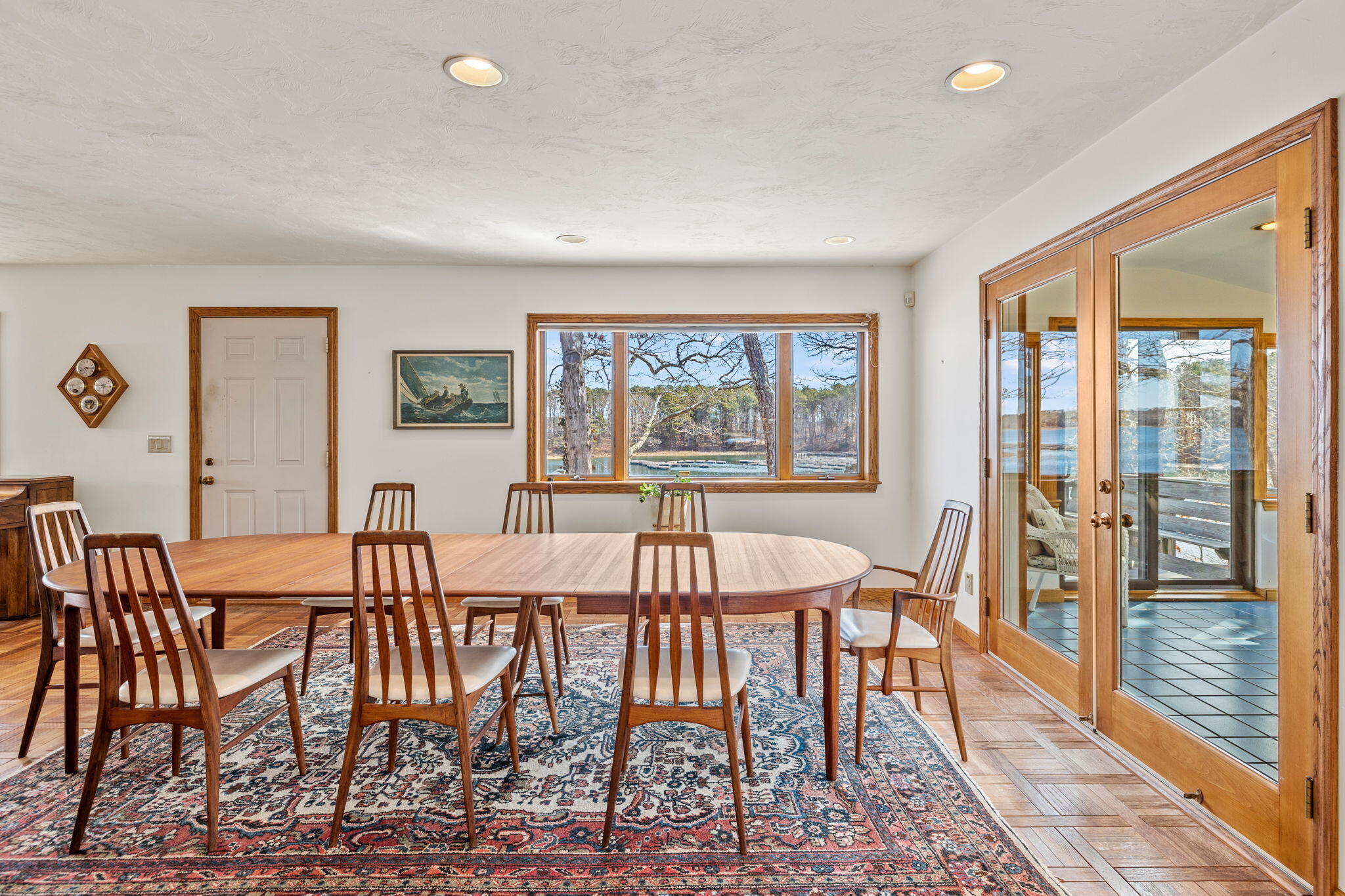 10 Circle Road East Falmouth, MA 02536 - Photo 19 of 65 a view of a dining room with furniture a rug and wooden floor