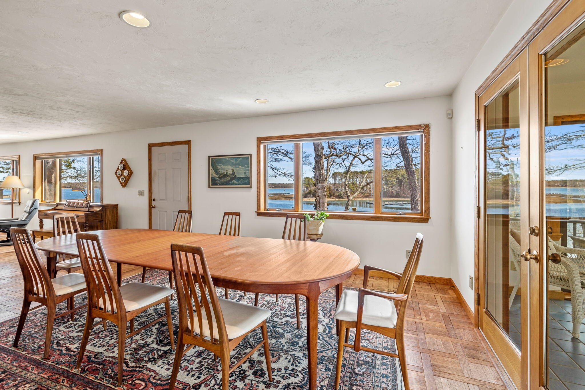 10 Circle Road East Falmouth, MA 02536 - Photo 20 of 65 a view of a dining room with furniture large window and wooden floor