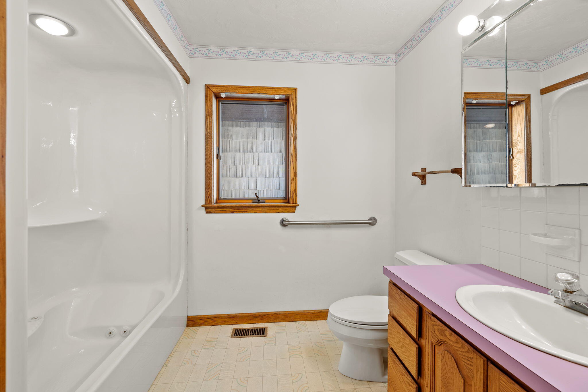 10 Circle Road East Falmouth, MA 02536 - Photo 28 of 65 a bathroom with a sink a toilet and shower