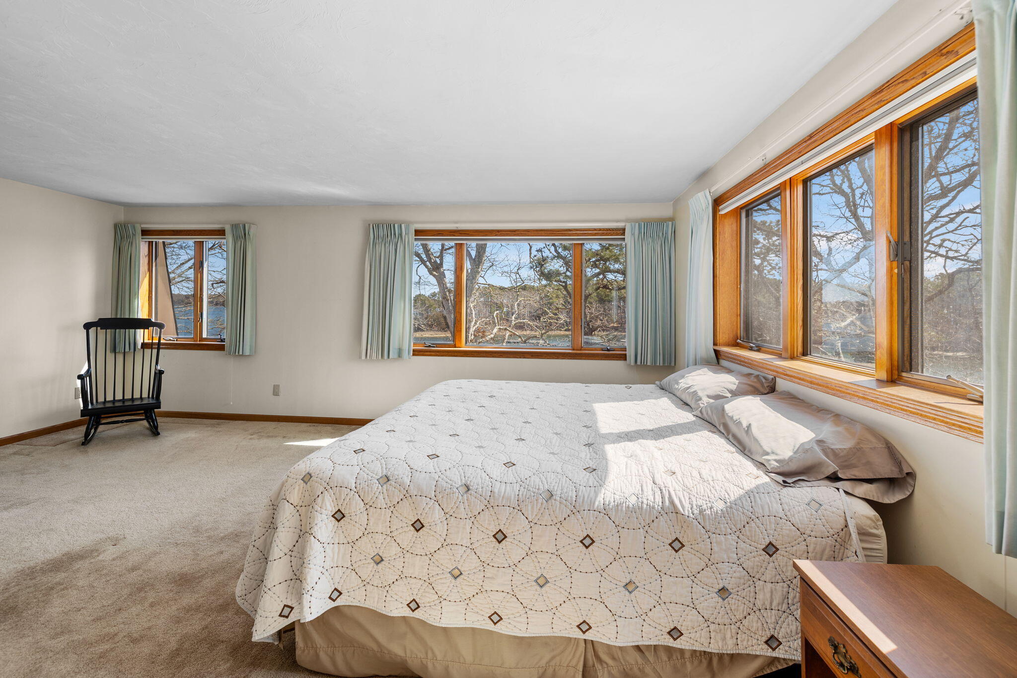 10 Circle Road East Falmouth, MA 02536 - Photo 29 of 65 a bedroom with a bed and a large window