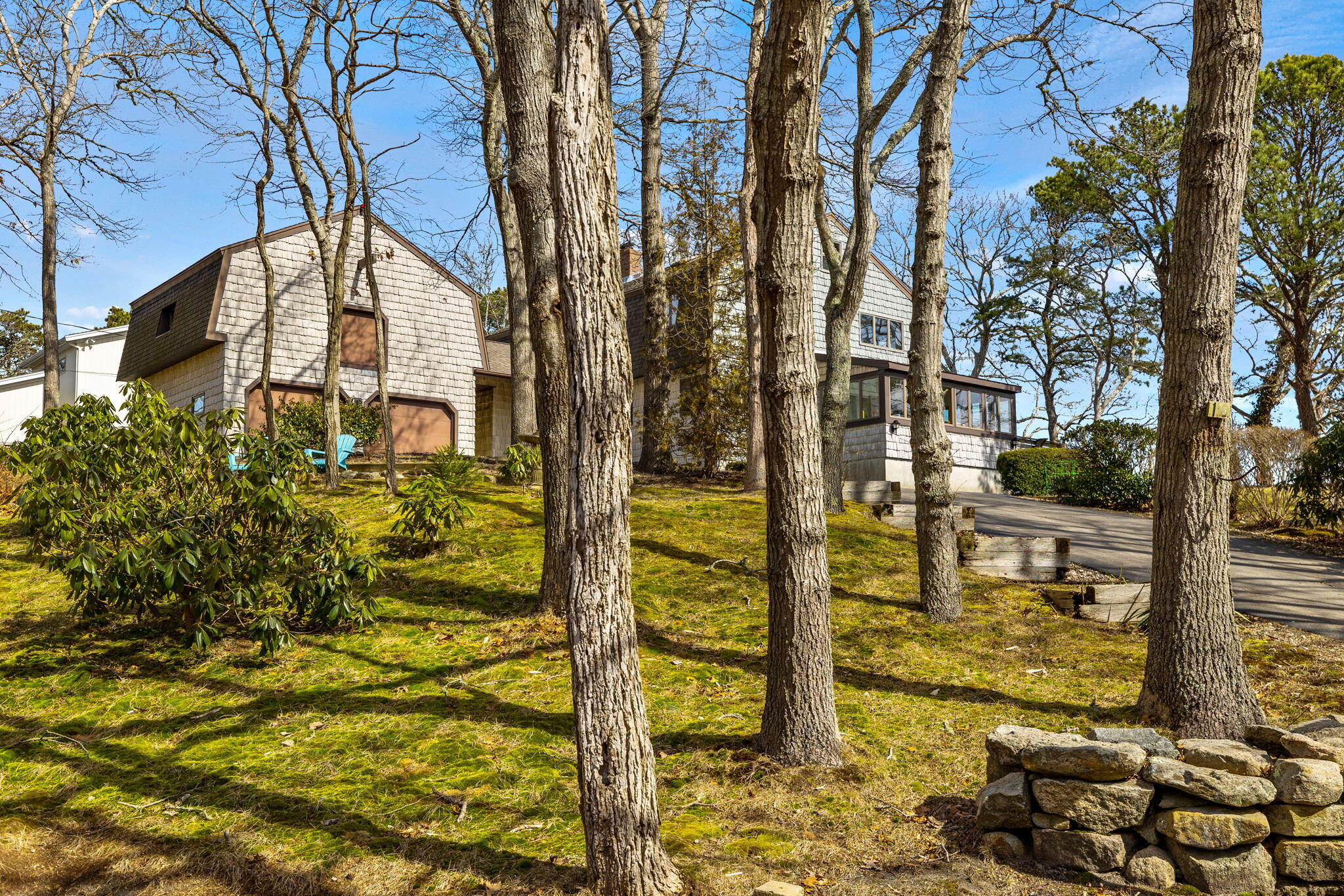 10 Circle Road East Falmouth, MA 02536 - Photo 39 of 65 a view of a tall brick building next to a yard