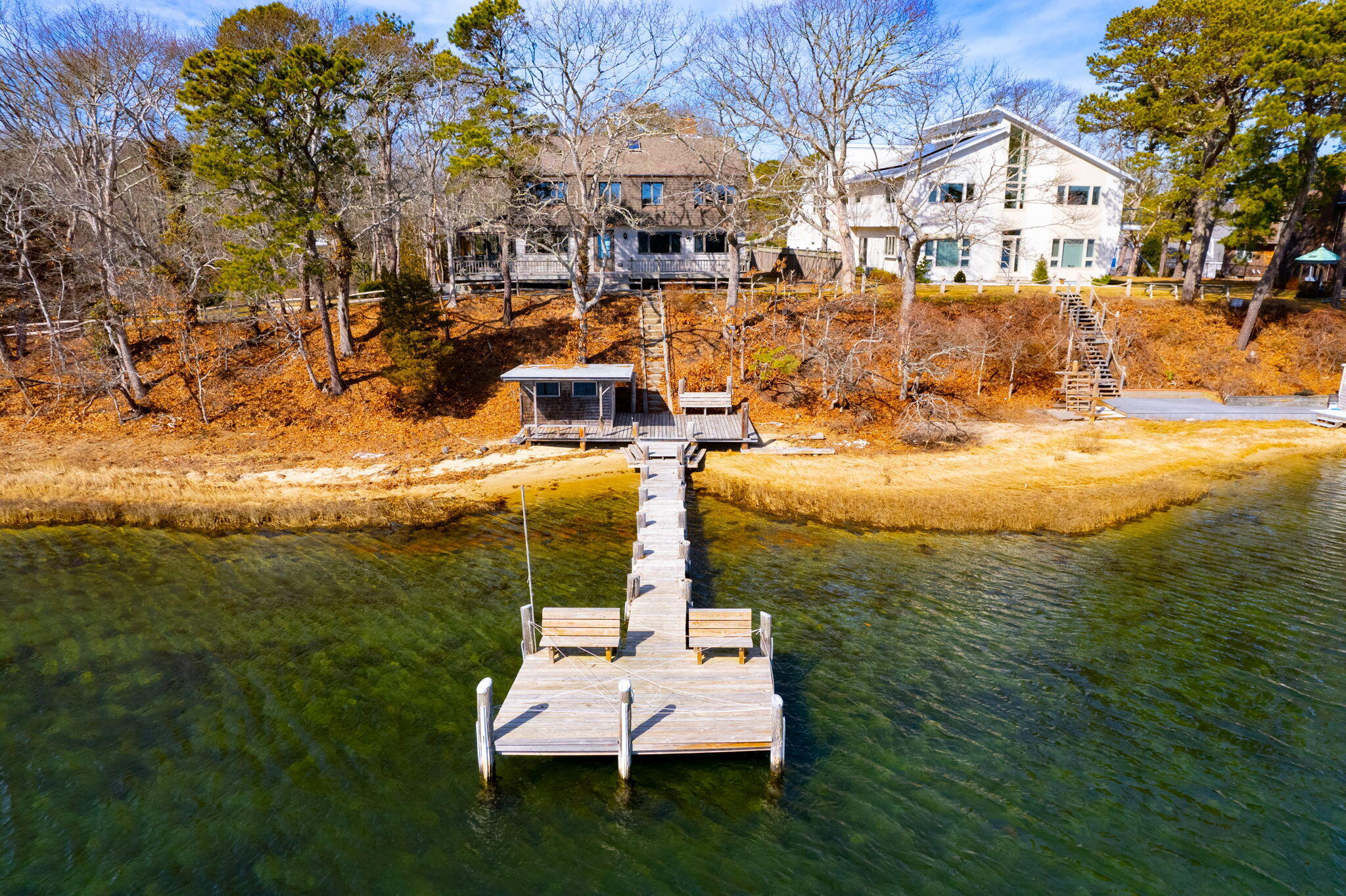 10 Circle Road East Falmouth, MA 02536 - Photo 55 of 65 a view of a lake with a house in the background