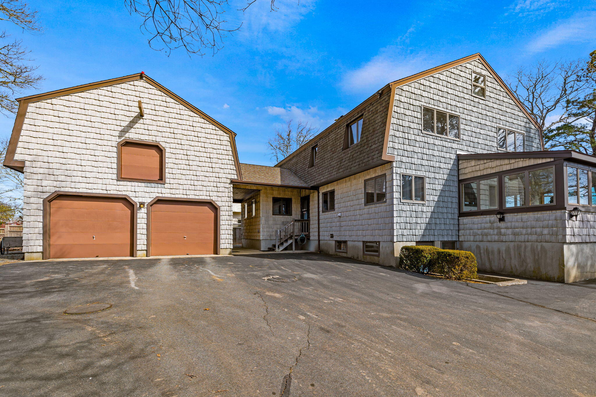 10 Circle Road East Falmouth, MA 02536 - Photo 9 of 65 a front view of a house with parking
