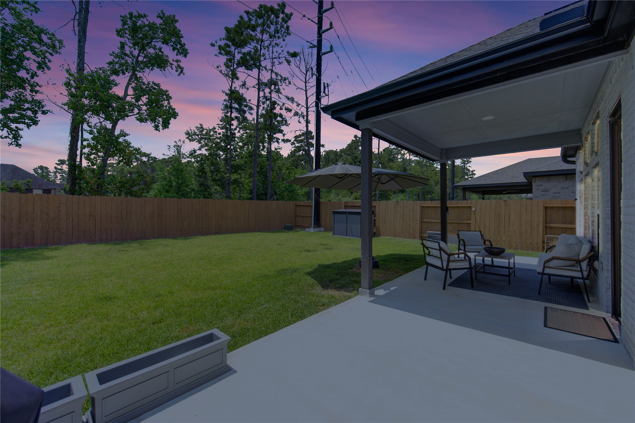 12110 Fletching Stone Lane Houston, TX 77044 - Photo 27 of 50 a view of backyard with seating space and garden