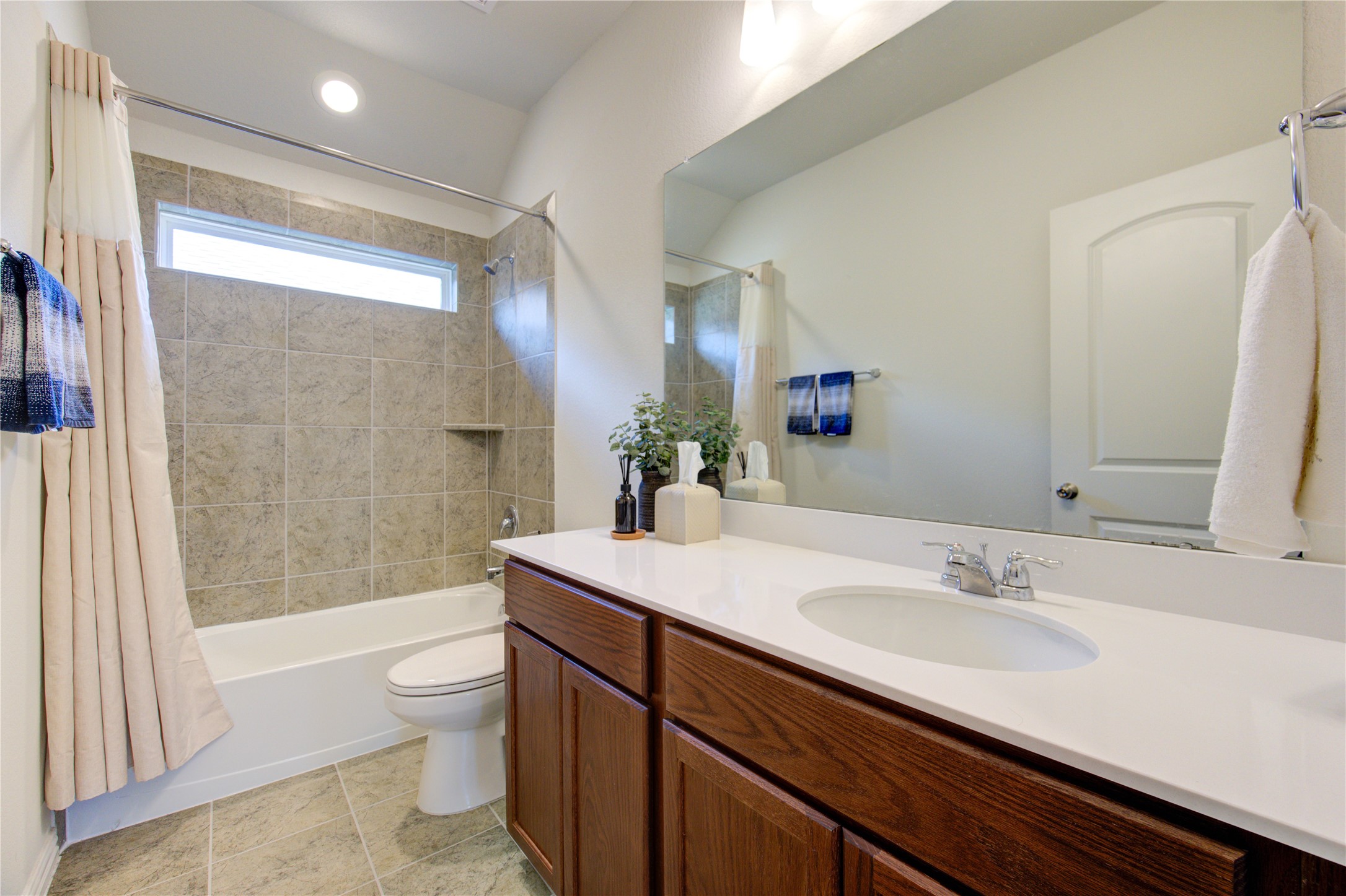 12110 Fletching Stone Lane Houston, TX 77044 - Photo 34 of 50 a bathroom with a sink a toilet and shower
