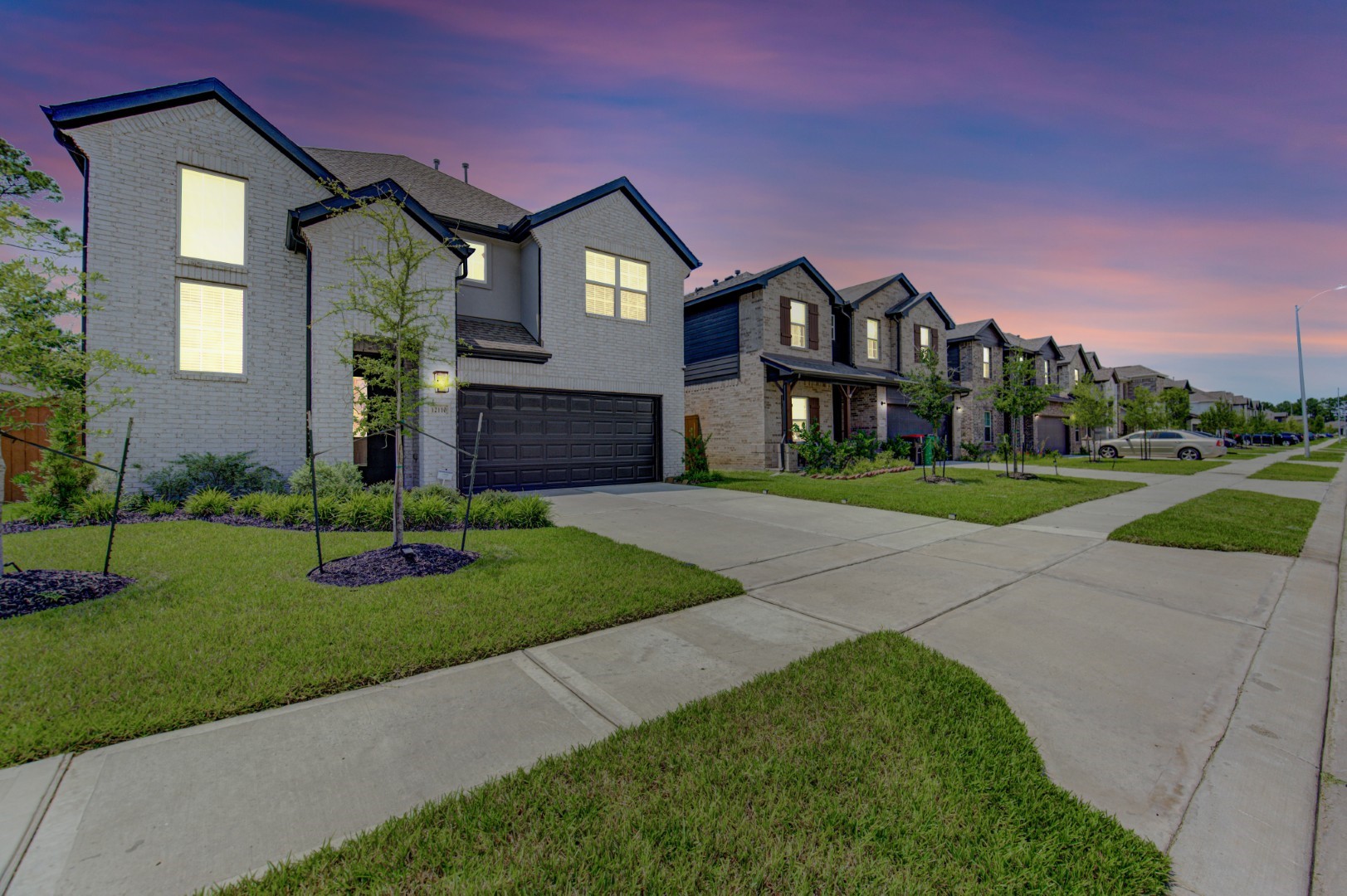 12110 Fletching Stone Lane Houston, TX 77044 - Photo 40 of 50 a front view of a house with a yard and garage