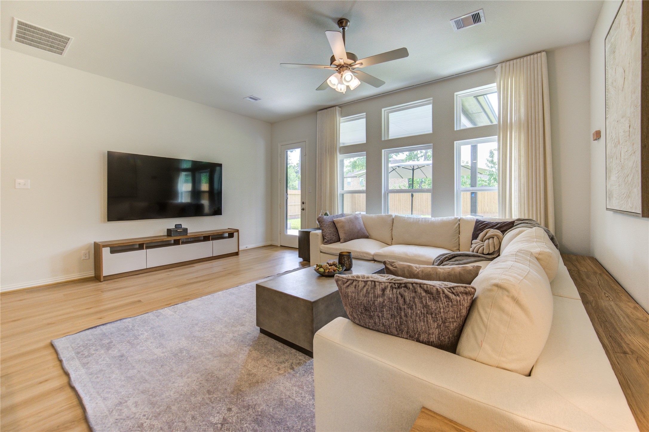 12110 Fletching Stone Lane Houston, TX 77044 - Photo 7 of 50 a living room with furniture and a flat screen tv