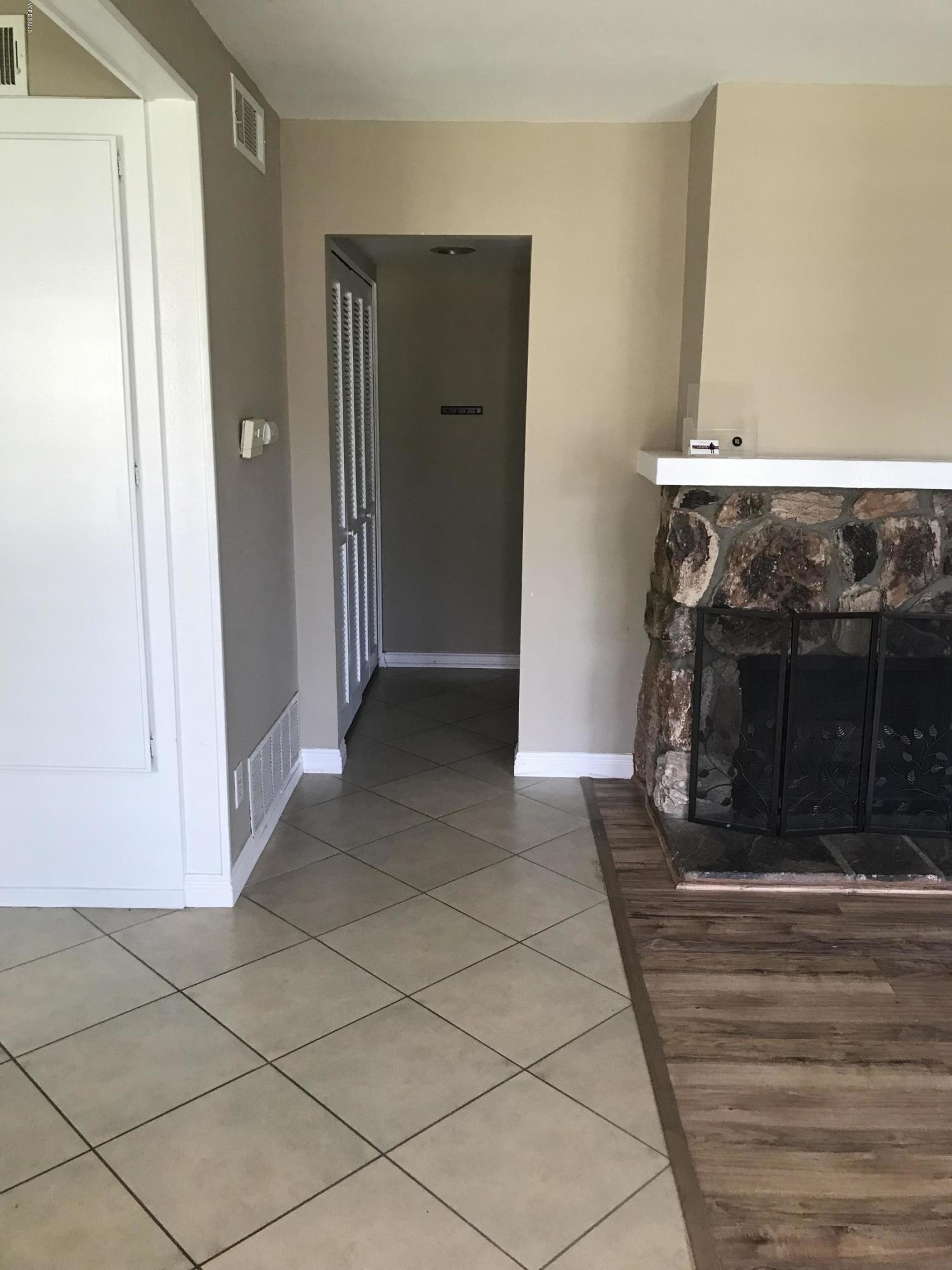 580 Spring Road, Unit 67 Moorpark, CA 93021 - Photo 14 of 43 a view of a livingroom with an empty space and a fireplace