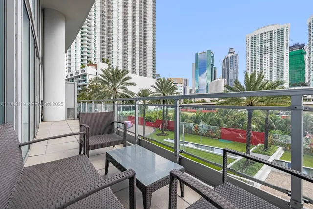 a view of a balcony with outdoor seating