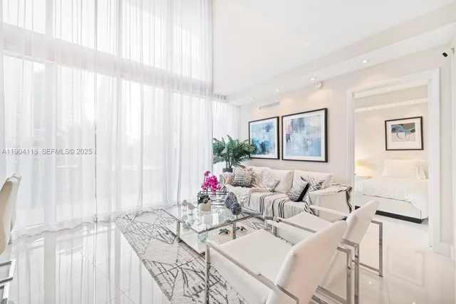 a living room with furniture and a large window