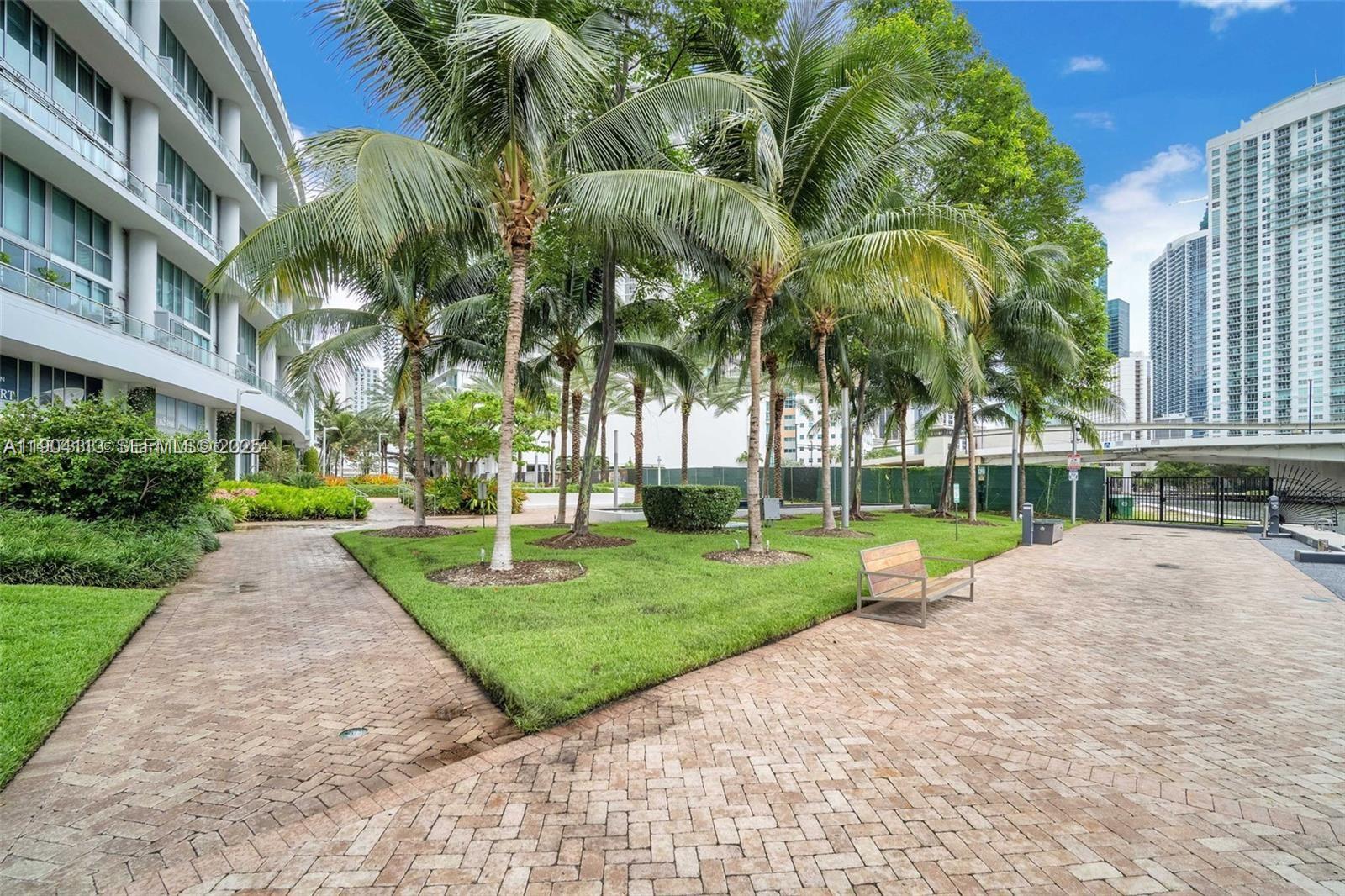 92 Southwest 3rd Street, Unit 310 Miami, FL 33130 - Photo 31 of 40 a view of a park with a palm trees