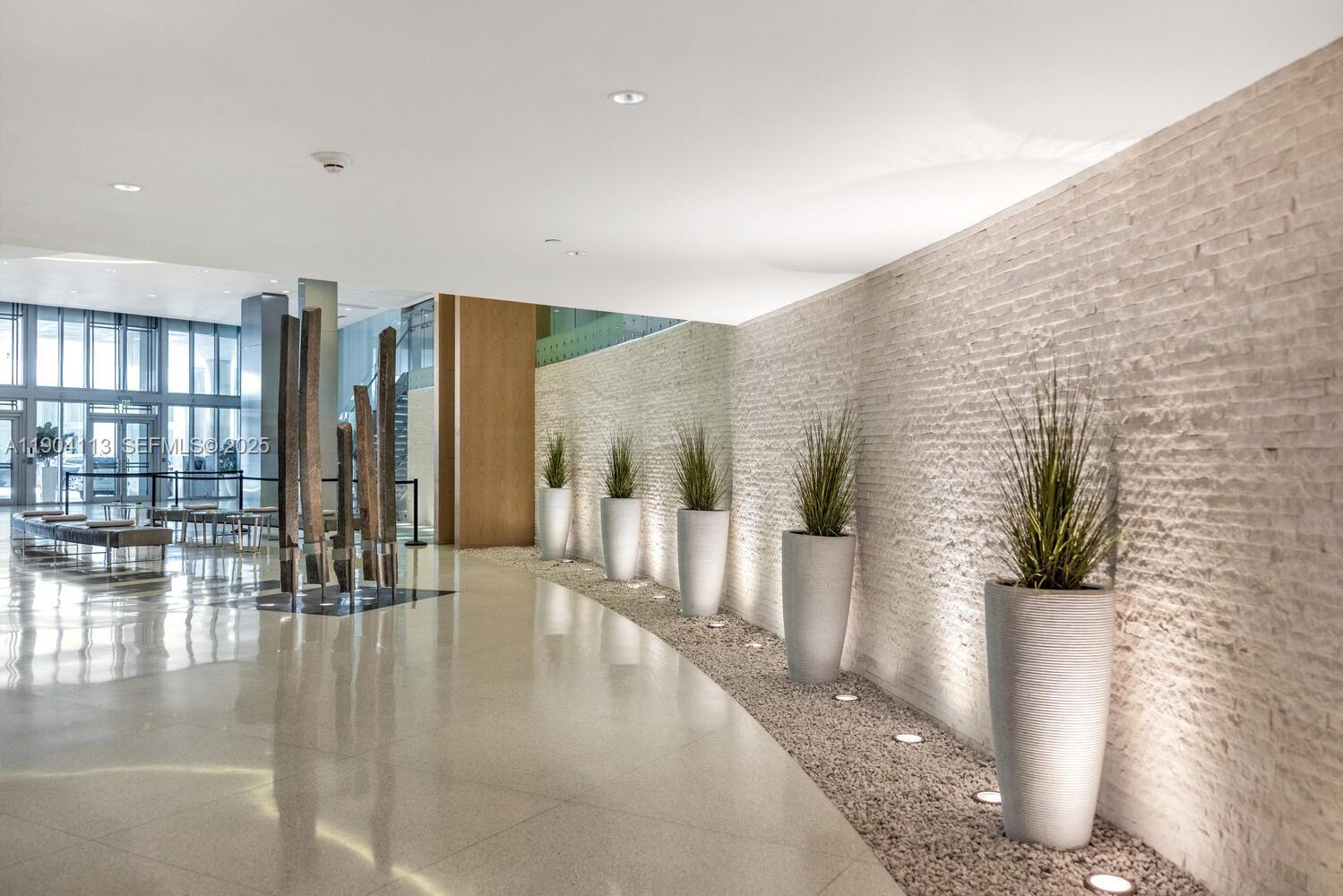 92 Southwest 3rd Street, Unit 310 Miami, FL 33130 - Photo 38 of 40 a lobby with furniture and floor to ceiling window