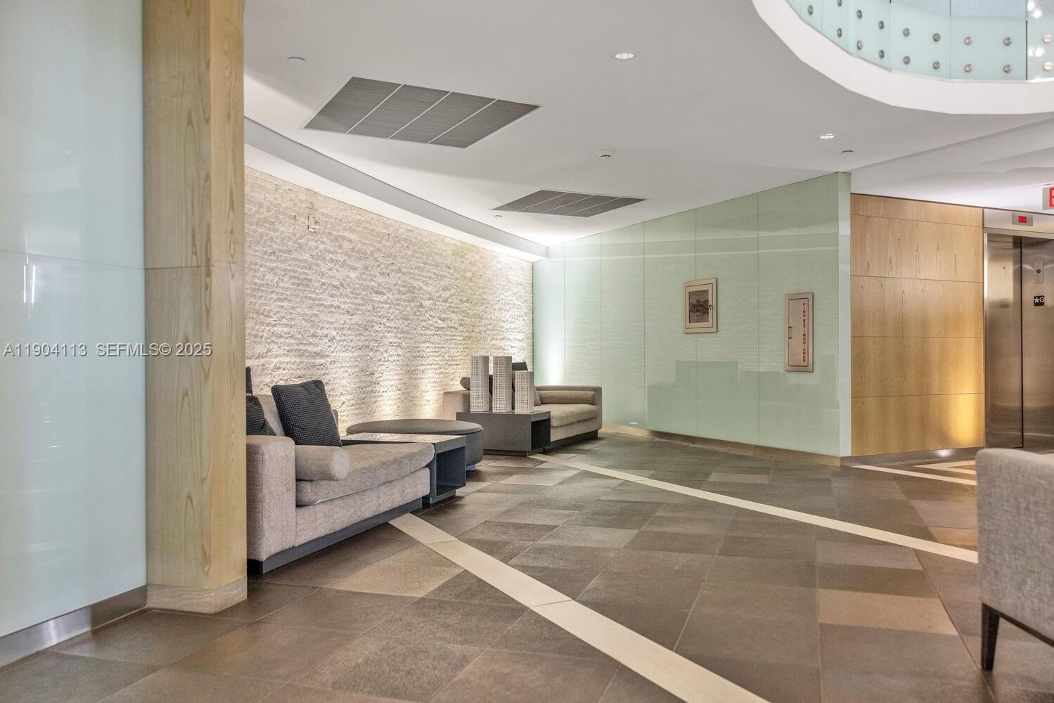 92 Southwest 3rd Street, Unit 310 Miami, FL 33130 - Photo 39 of 40 a view of a livingroom with furniture and staircase