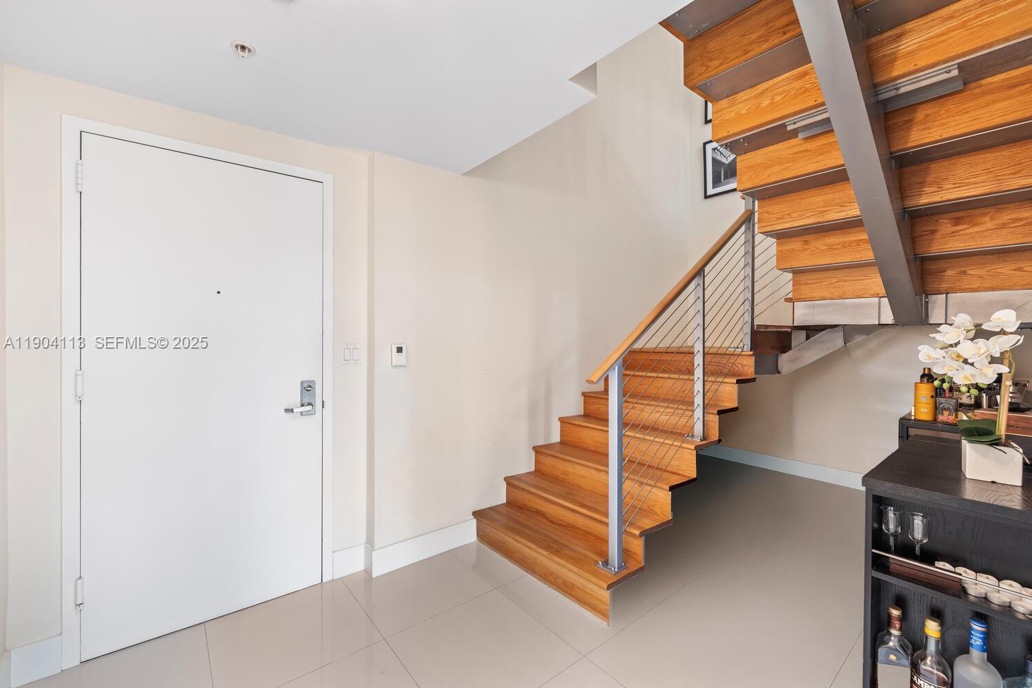 92 Southwest 3rd Street, Unit 310 Miami, FL 33130 - Photo 8 of 40 a view of entryway and hall with wooden floor