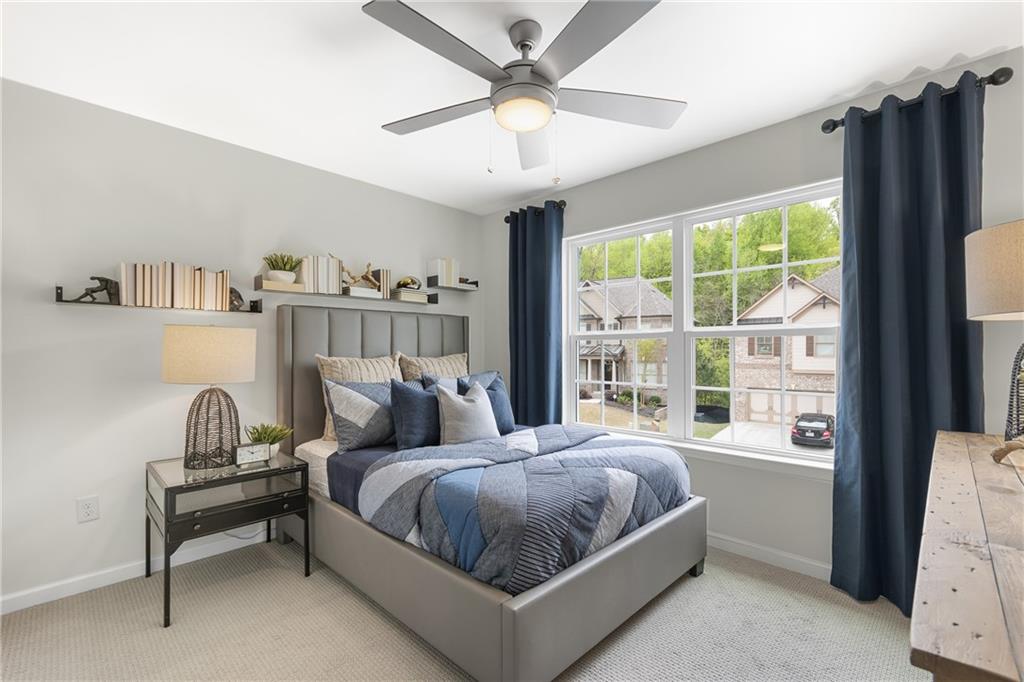 4387 Azalea Ridge Way Hoschton, GA 30548 - Photo 20 of 30 a bedroom with a bed and a window