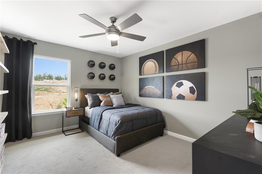 4387 Azalea Ridge Way Hoschton, GA 30548 - Photo 21 of 30 a bedroom with a large bed and a window