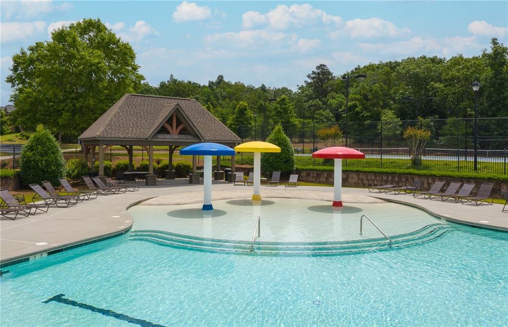 4387 Azalea Ridge Way Hoschton, GA 30548 - Photo 27 of 30 a view of pool with table and chairs
