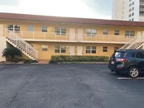 a view of a car in front of a house