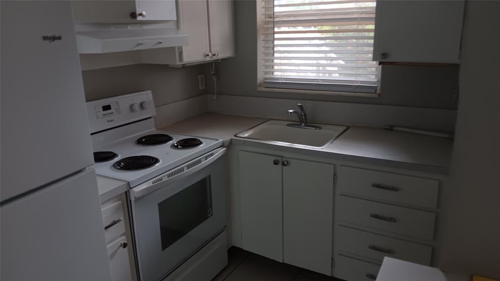 2121 North Ocean Boulevard, Unit 3 Fort Lauderdale, FL 33305 - Photo 11 of 12 a kitchen with a stove and a sink