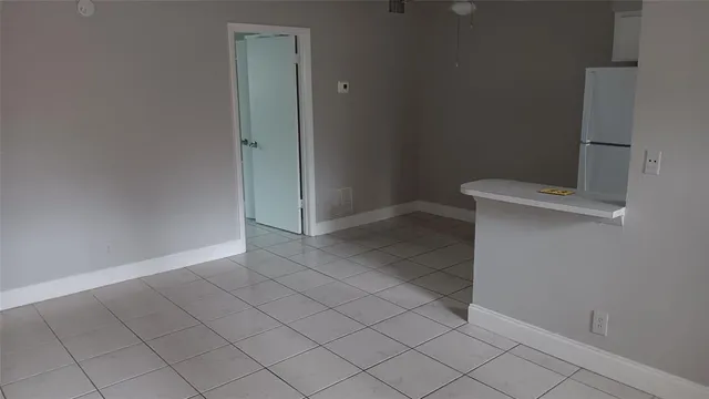 an empty room with white door