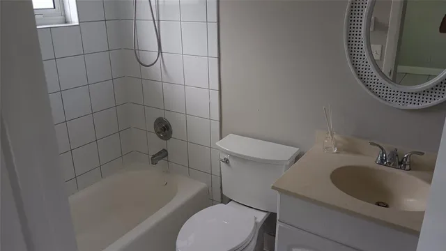 a bathroom with a sink a toilet and bathtub