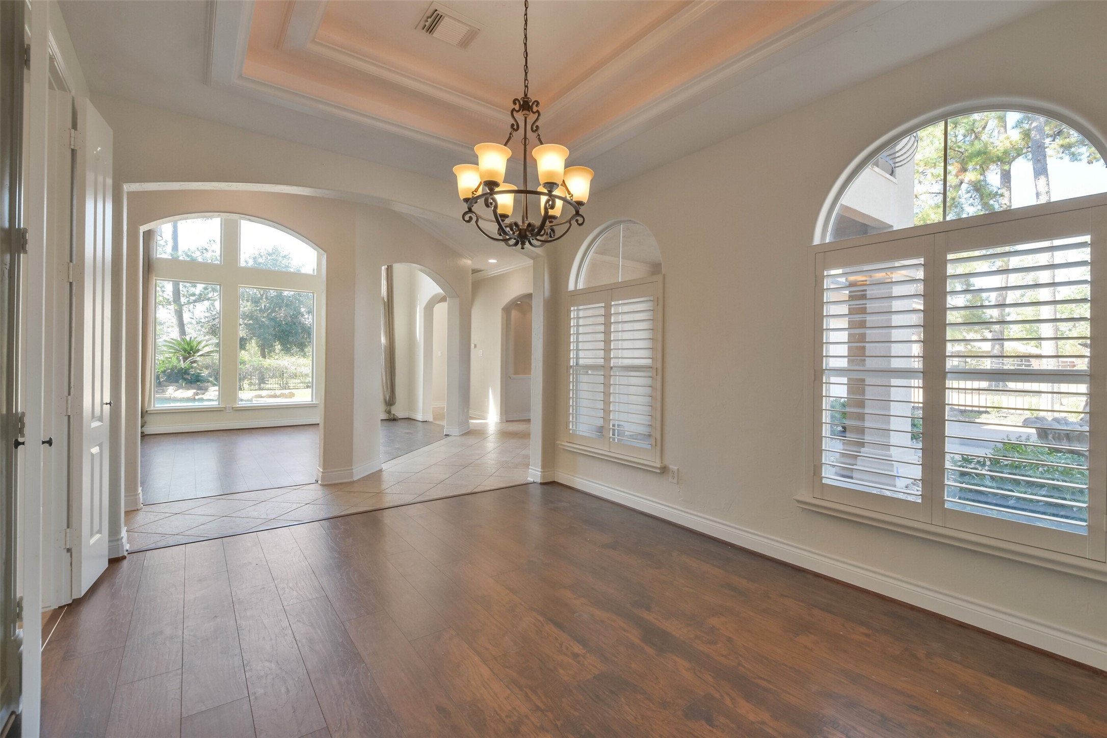 8114 Hideaway Lake Circle Spring, TX 77389 - Photo 16 of 50 a view of a room with wooden floors and chandelier
