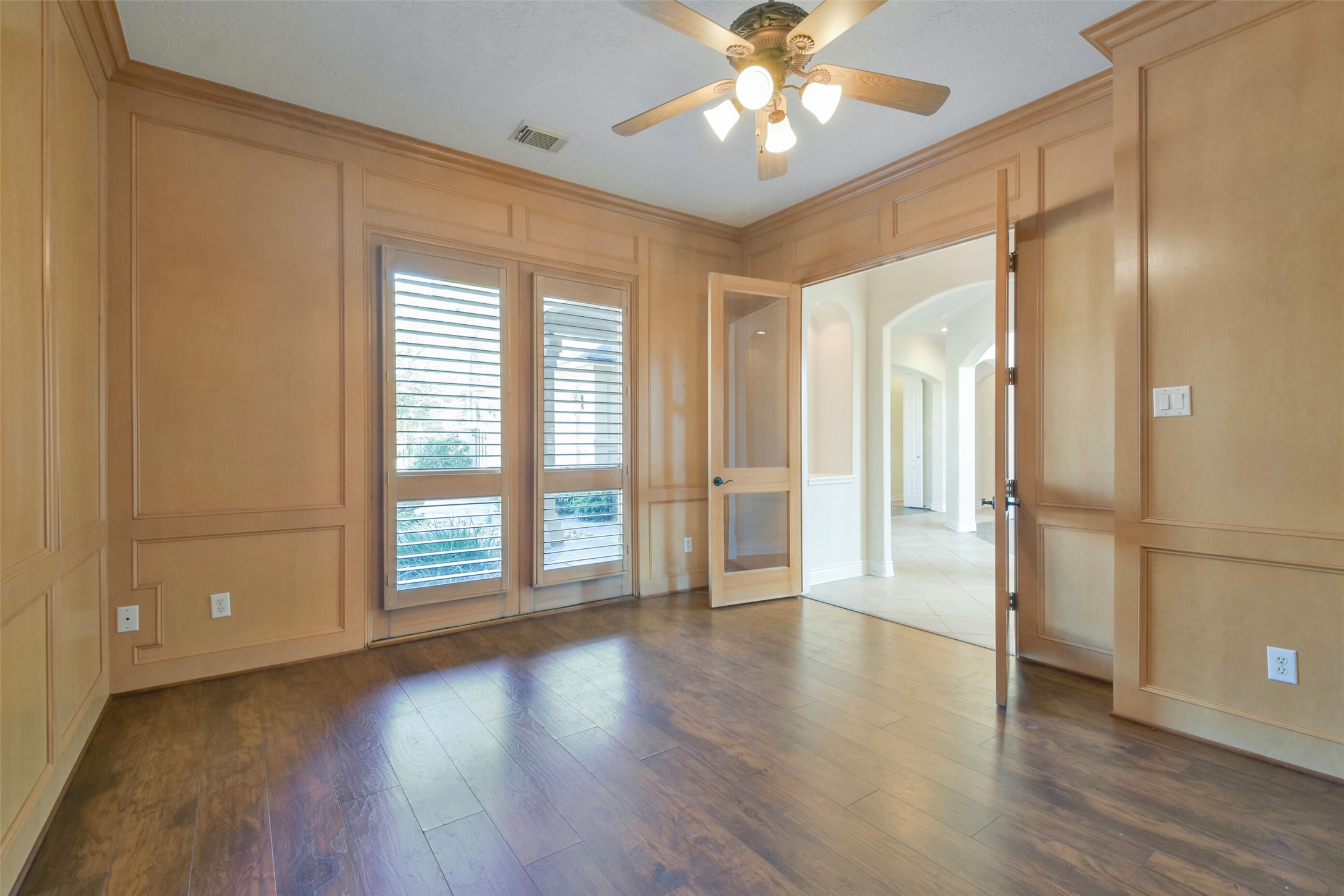 8114 Hideaway Lake Circle Spring, TX 77389 - Photo 18 of 50 a view of an empty room with a window and wooden floor