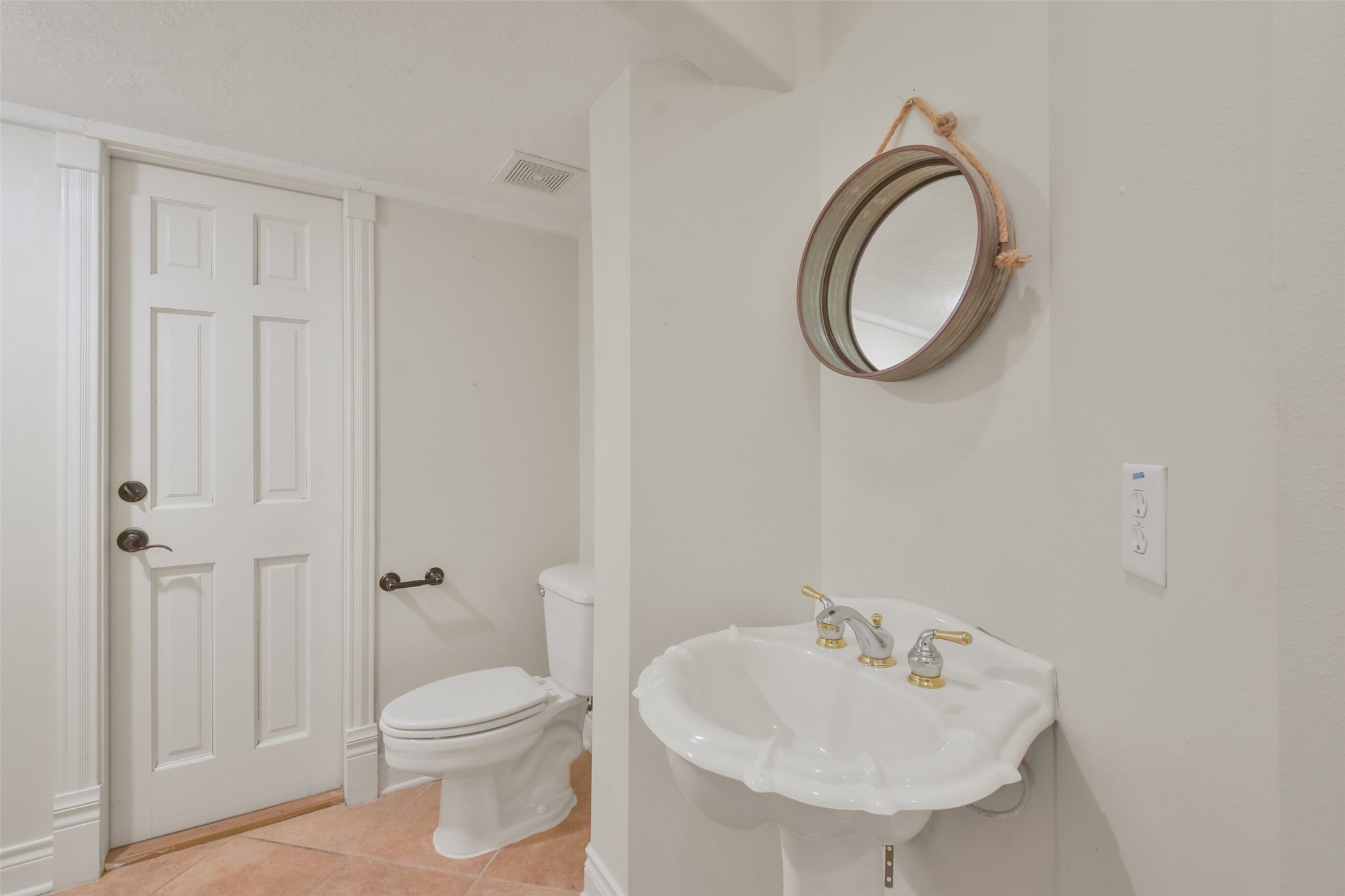 8114 Hideaway Lake Circle Spring, TX 77389 - Photo 19 of 50 a bathroom with a sink a toilet and a mirror