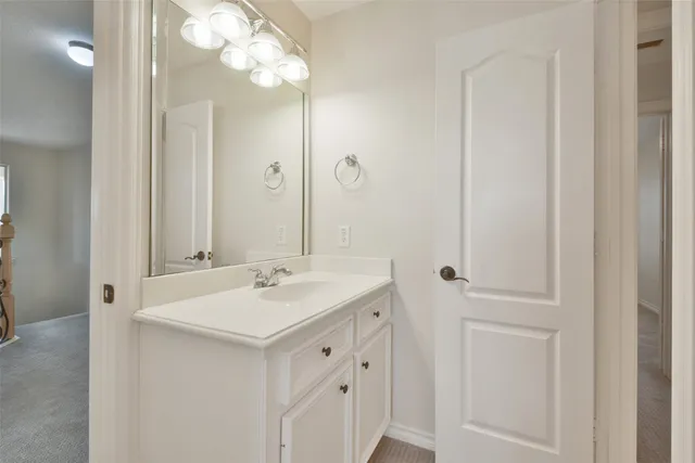 an aerial view of a house with a yard and potted plants