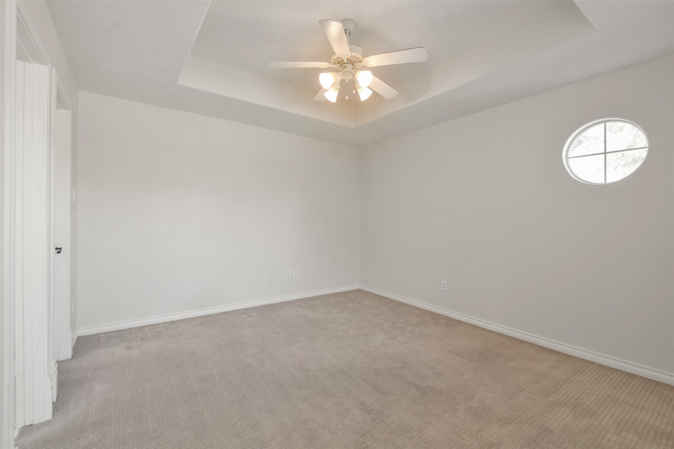 8114 Hideaway Lake Circle Spring, TX 77389 - Photo 35 of 50 an empty room with a chandelier fan and windows