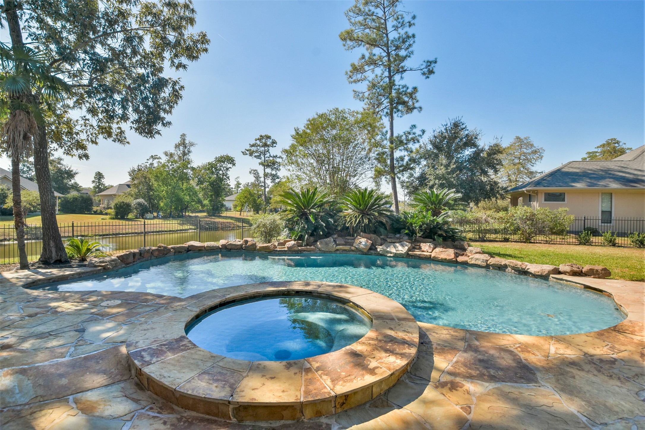 8114 Hideaway Lake Circle Spring, TX 77389 - Photo 39 of 50 a view of a swimming pool with a sitting space