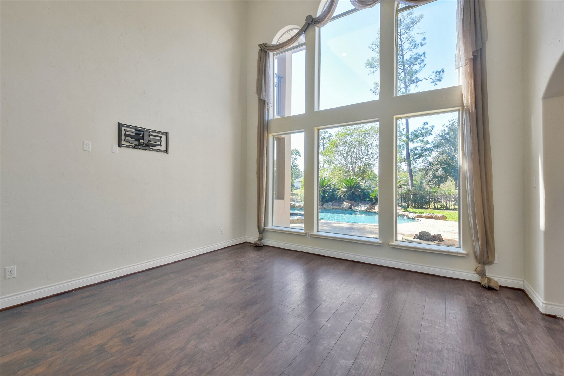 8114 Hideaway Lake Circle Spring, TX 77389 - Photo 5 of 50 a view of an empty room with wooden floor and a window