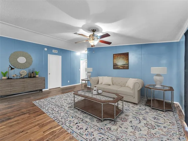 a living room with furniture rug and window