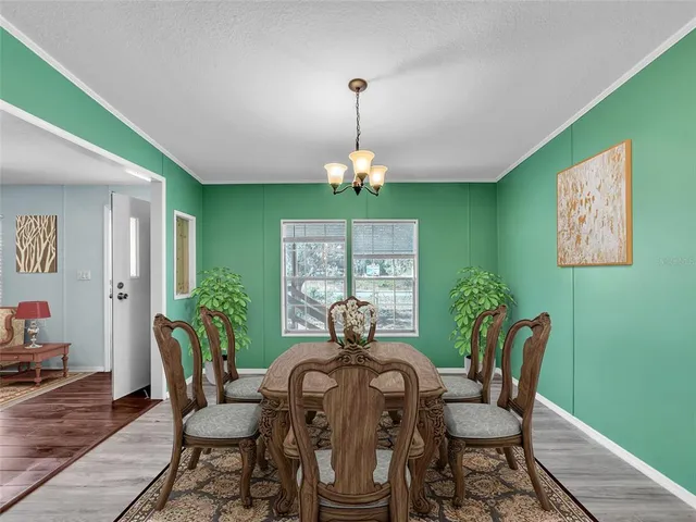 a living room with fireplace furniture and a wooden floor