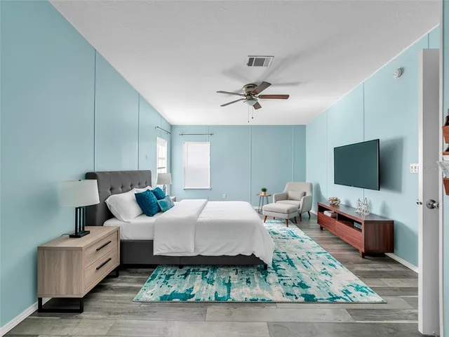 a spacious bathroom with a double vanity sink mirror and a bathtub