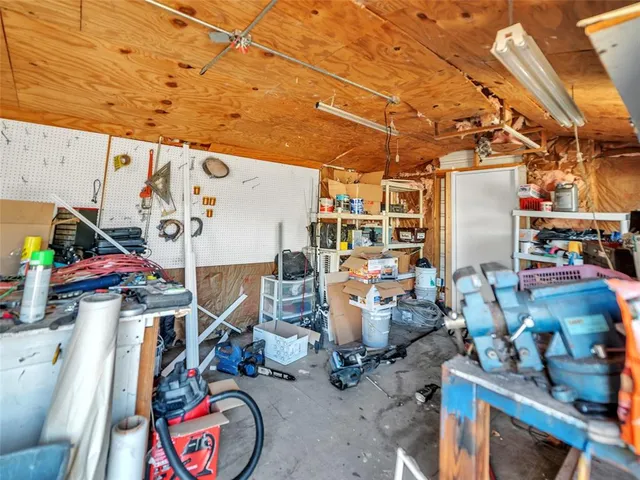 an aerial view of a house with yard and outdoor seating