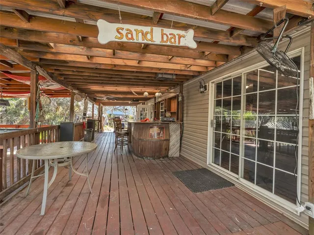 a view of a chairs in wooden deck