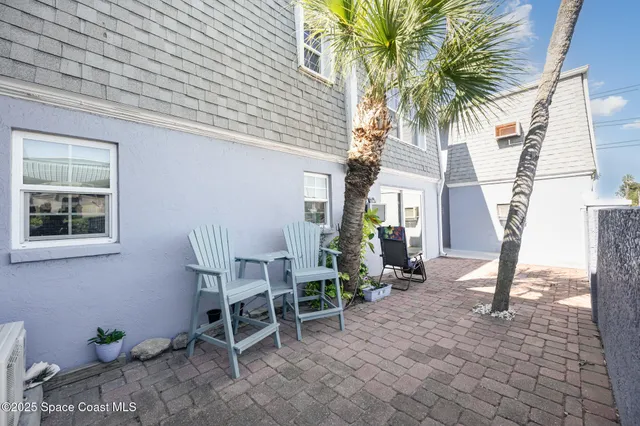 a view of backyard with outdoor seating and garage