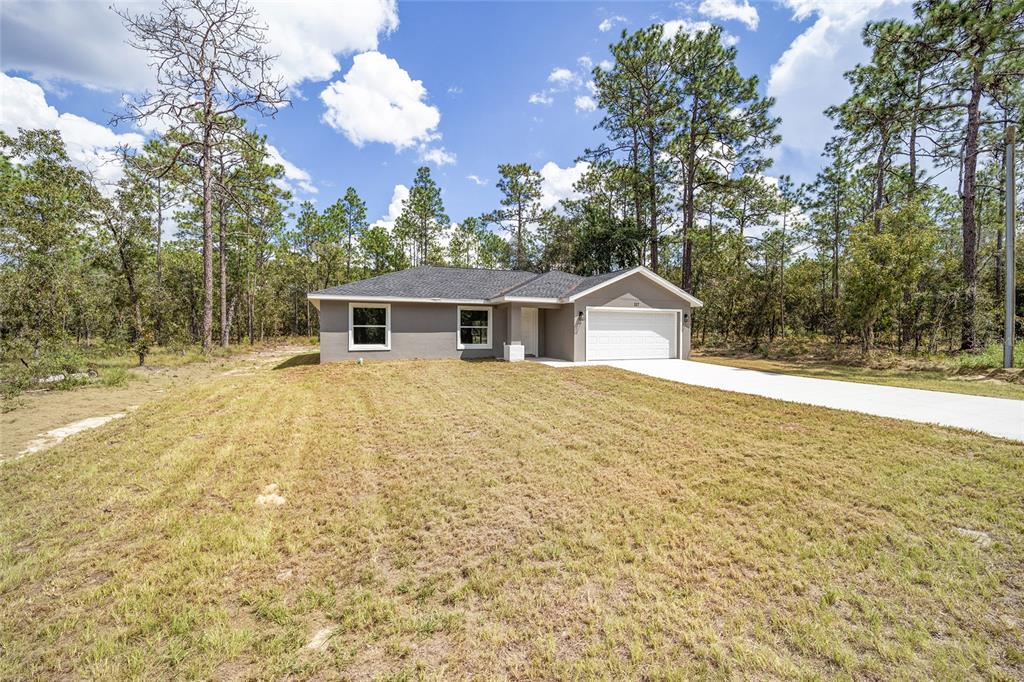 117 Northwest Sparrow Road Dunnellon, FL 34431 - Photo 1 of 1 a view of a house with a yard