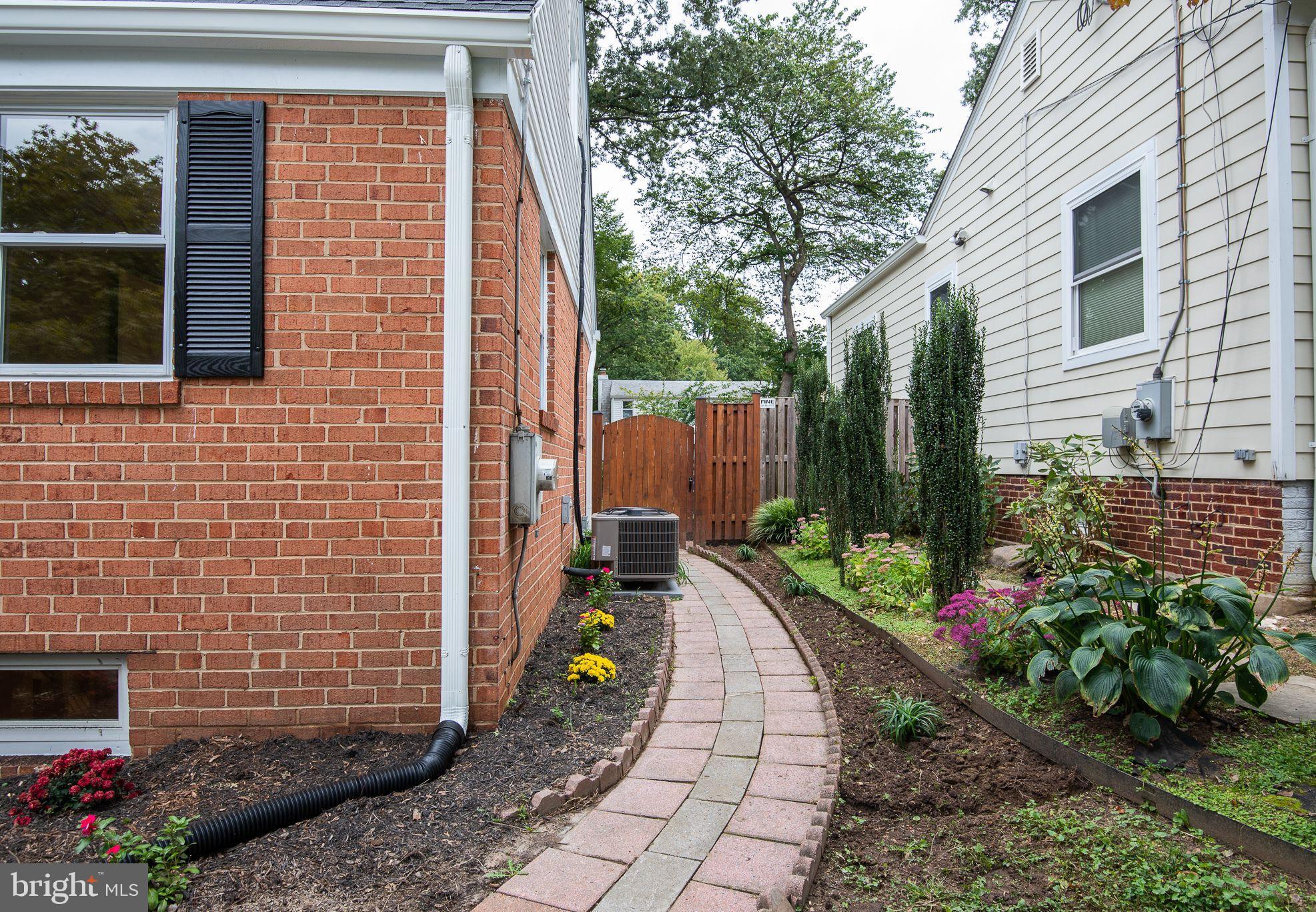 9113 Walden Road Silver Spring, MD 20901 - Photo 3 of 39 Side Walkway to Fenced Backyard and New Patio