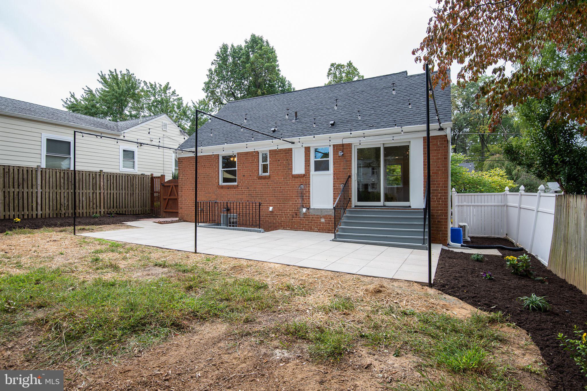 9113 Walden Road Silver Spring, MD 20901 - Photo 37 of 39 Rear Porch w Attached Framing and Hanging Lights.