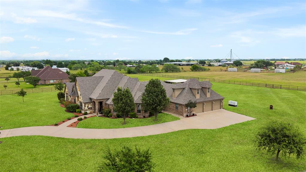 219 Mohundro Road Ferris, TX 75125 - Photo 4 of 40 an aerial view of a house with garden space and lake view in back