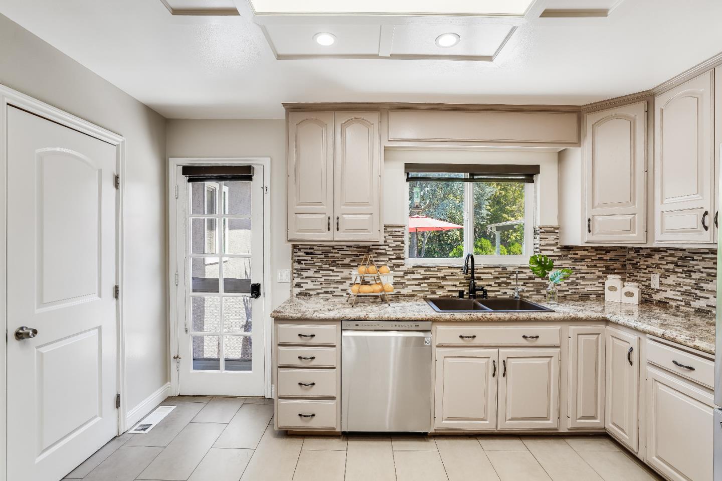 2275 Grant Road Los Altos, CA 94024 - Photo 23 of 66 a kitchen with white cabinets and window