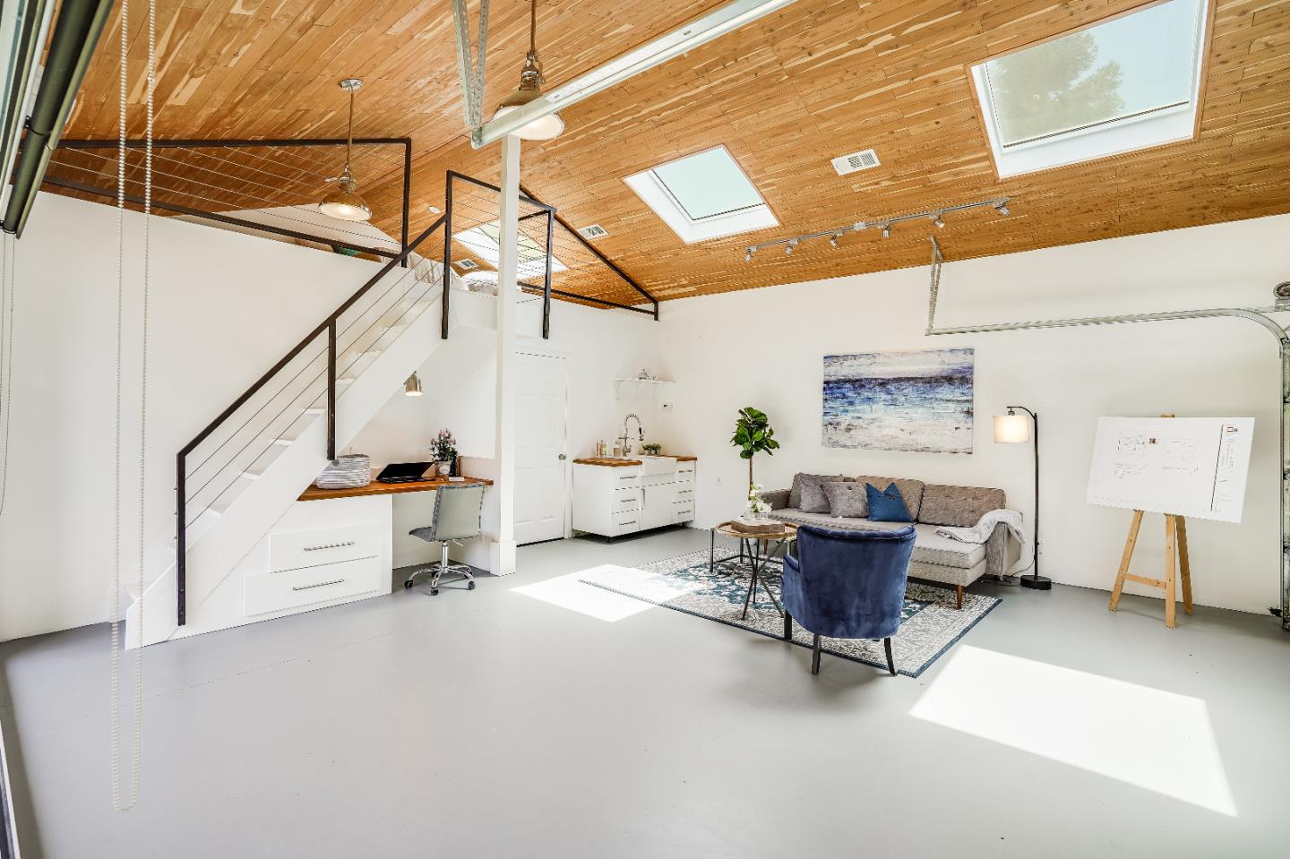 2275 Grant Road Los Altos, CA 94024 - Photo 28 of 66 a living room with furniture and a chandelier